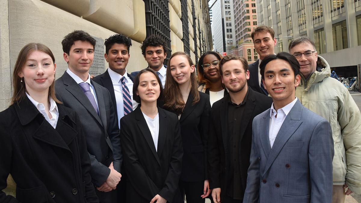 The Pace University Federal Reserve Challenge team standing outside after winning the New York Regional College Federal Reserve Challenge competition