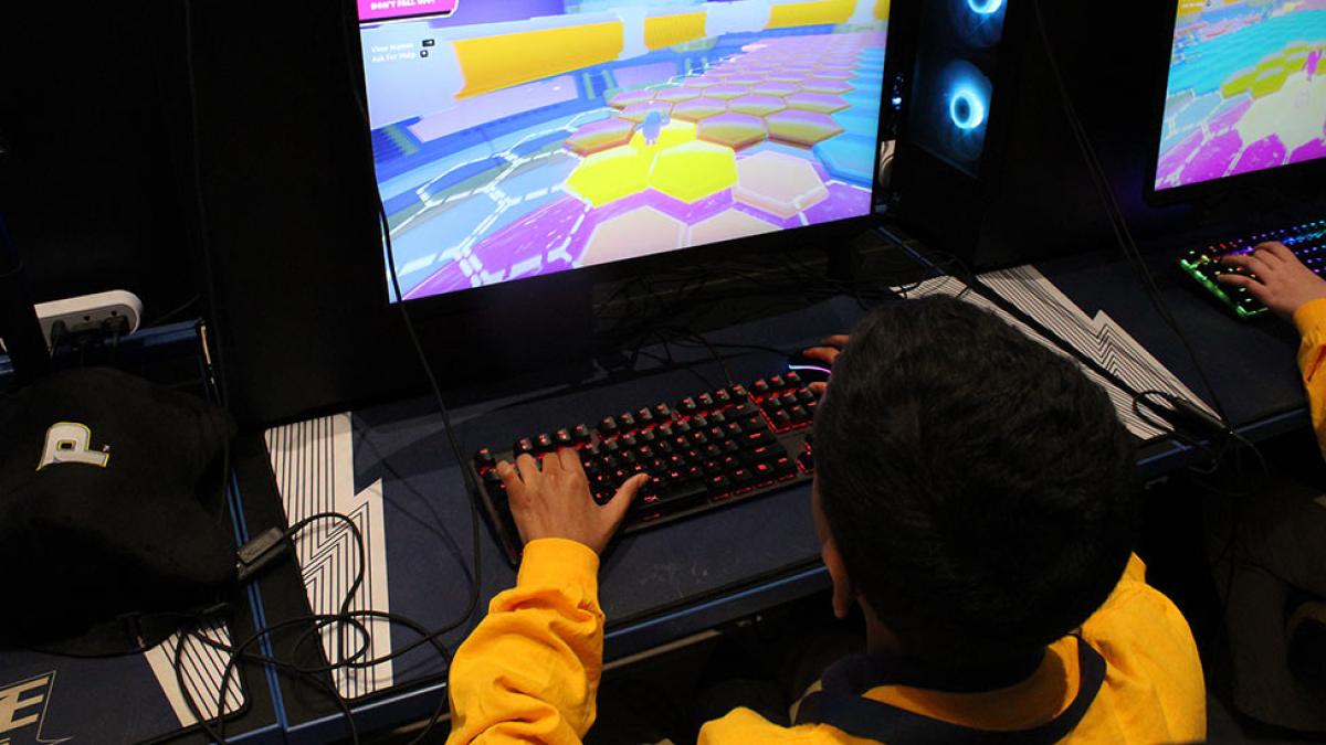 A New York middle school student plays a video game at the Pace Esports Arena.