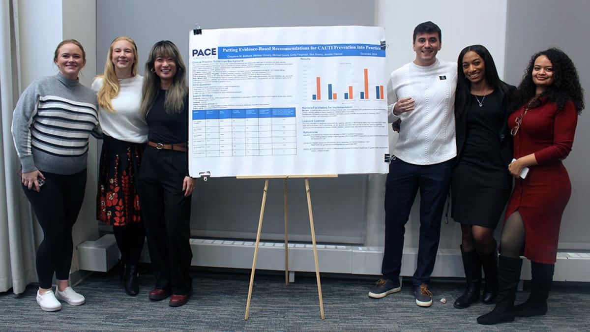 college of health professions Adult-Gerontology Acute Care Nurse Practitioner students presenting their poster project.