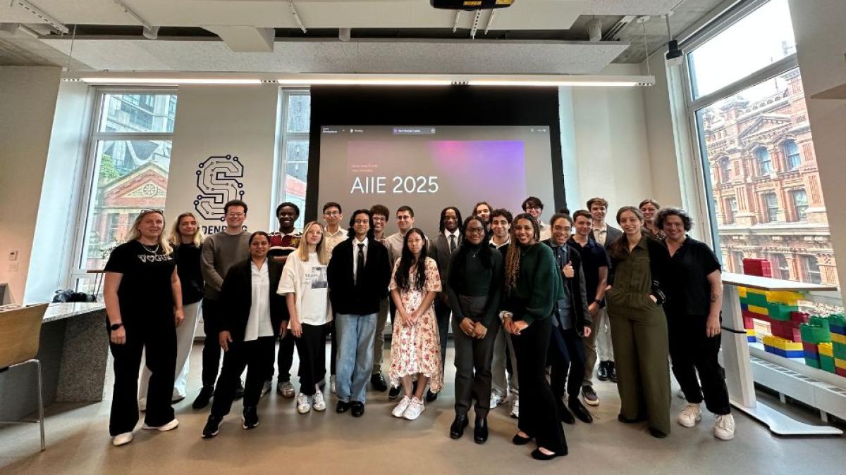The 2025 AI Internship Experience interns, faculty, and staff posing for a photo in the Seidenberg Design Factory space.