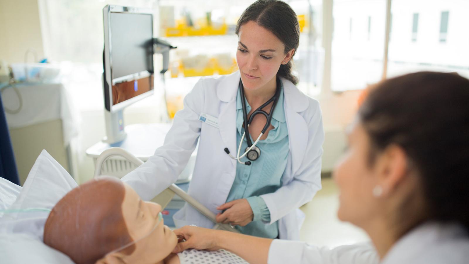 Lienhard School of Nursing student working in a clinical setting.