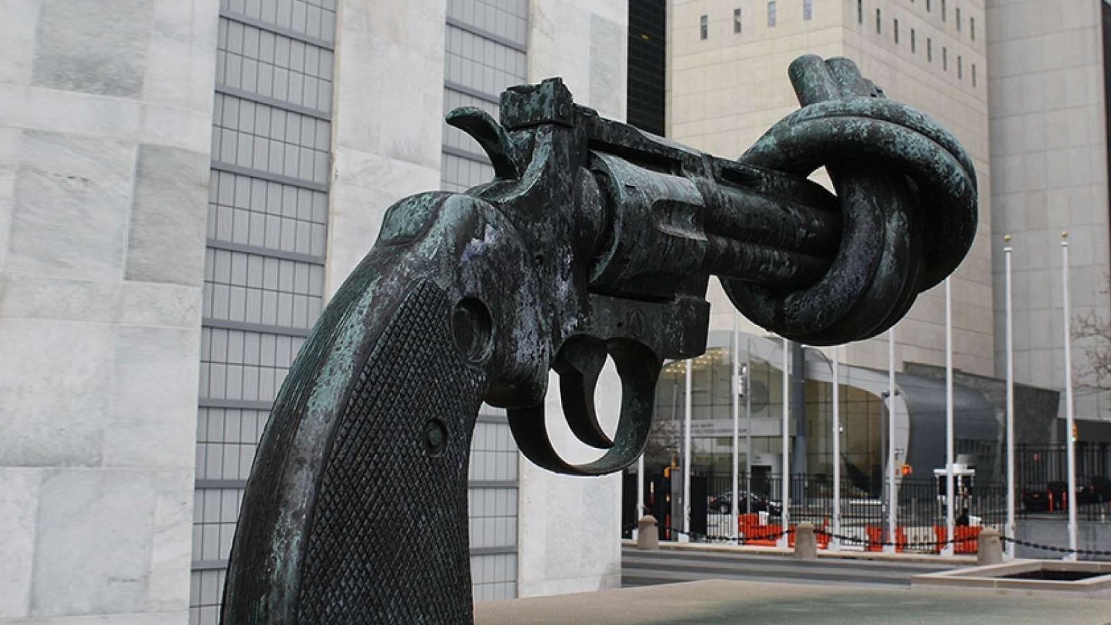 Sculpture of a gun with barrel twisted in a knot