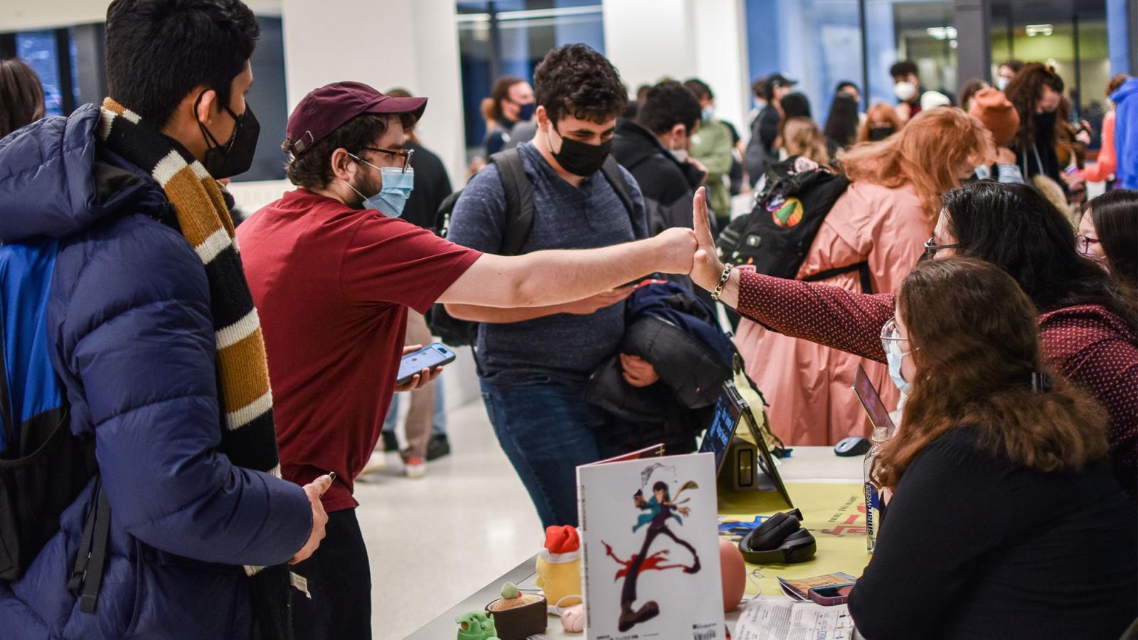 students fist bumping