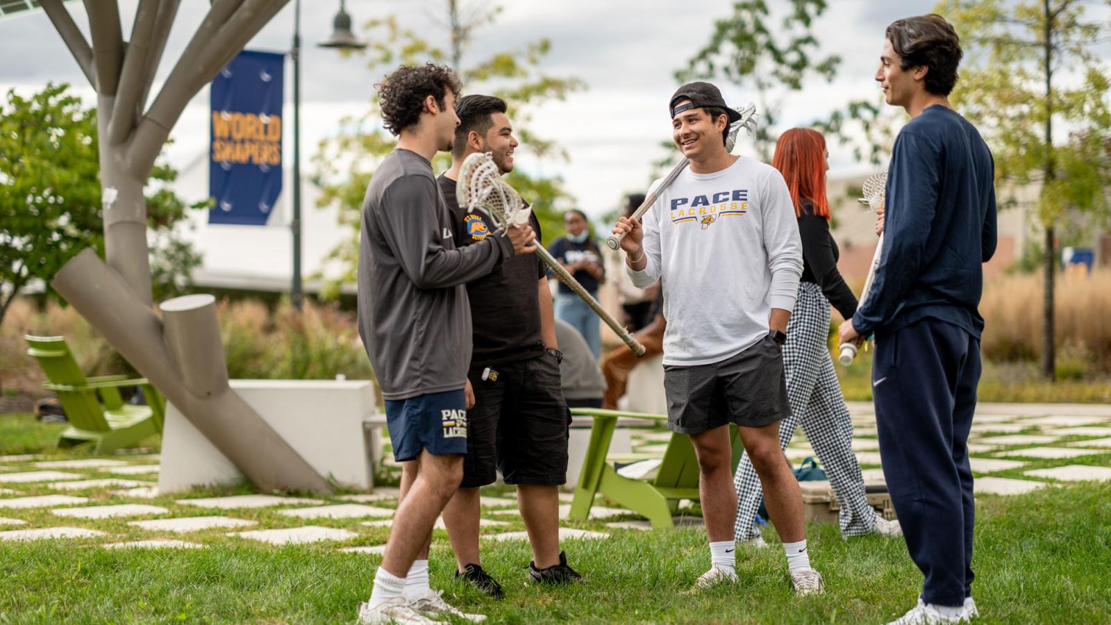 young men with lacrosse sticks