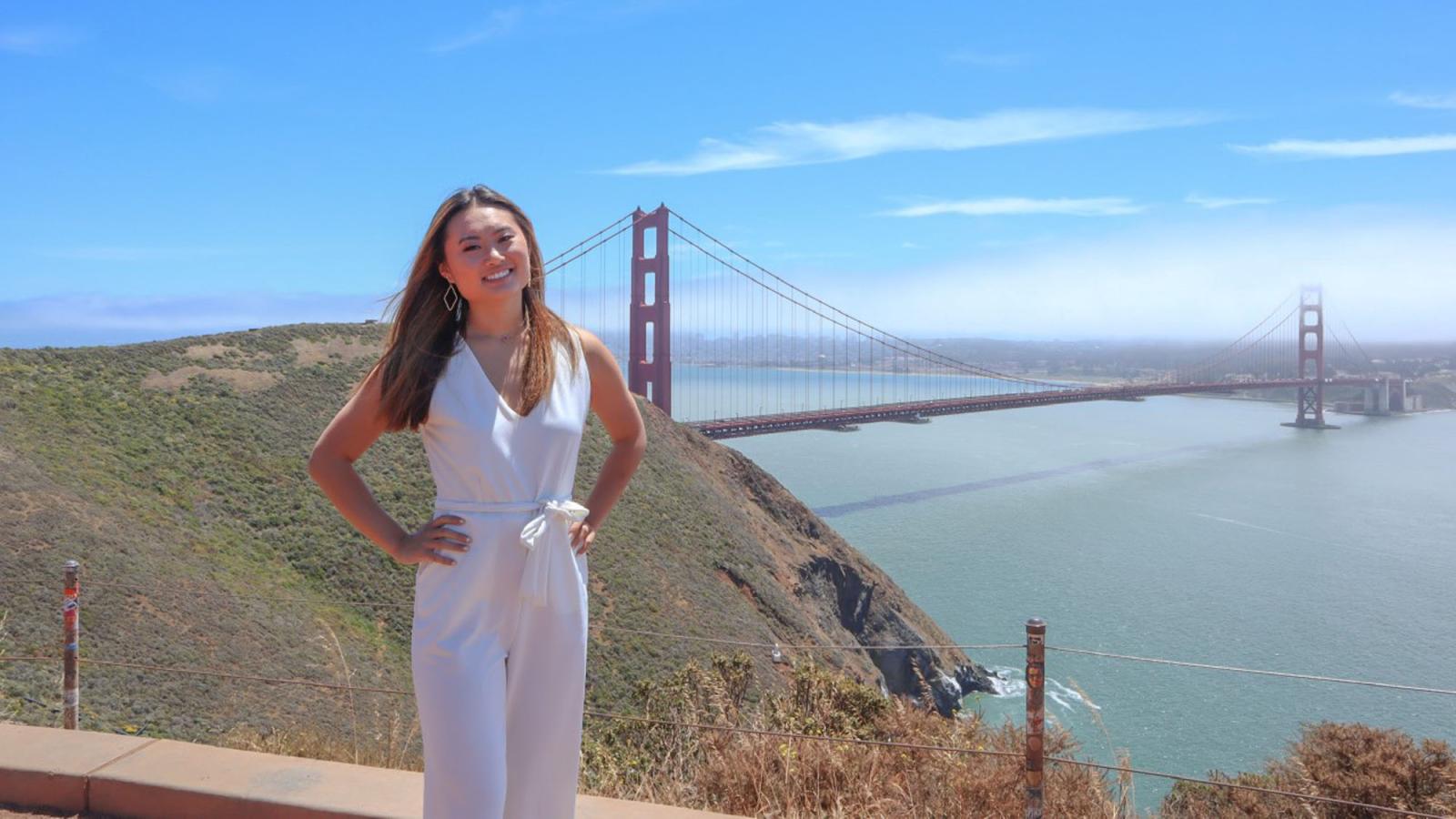 Lubin student Christal Wong '22 standing in front of the Golden Gate Bridge in California