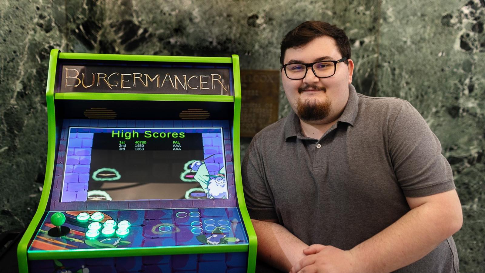 Pace University Seidenberg student, Michael Falco with his arcade video game, Burgermancer