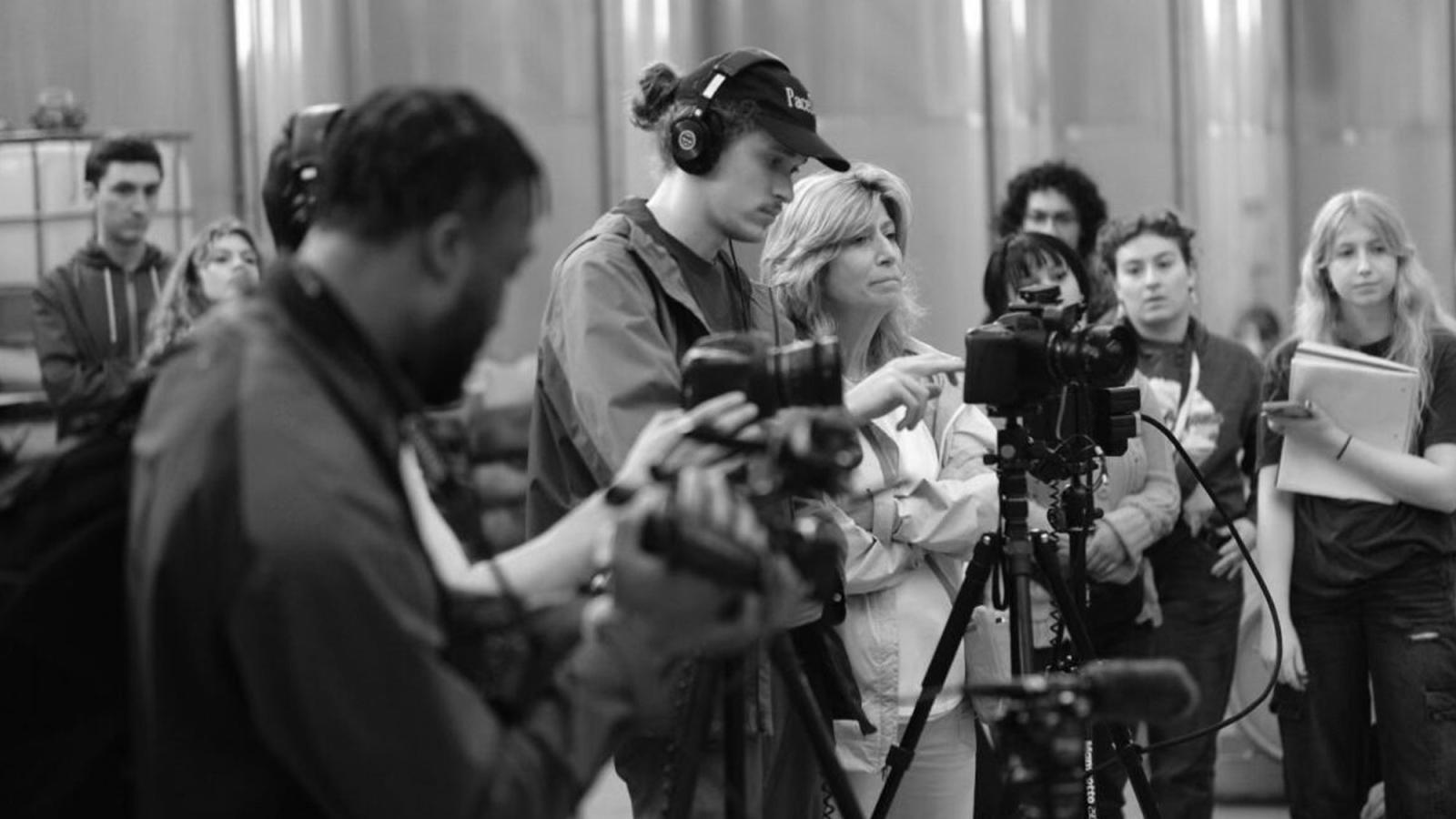 black and white candid photo of the PaceDocs team filming in Spain.