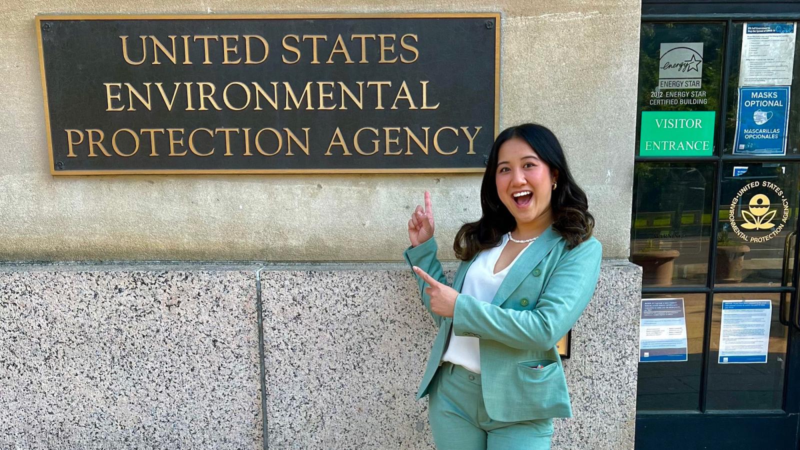 Elisabeth Haub School of Law student ThuLan Pham standing in front of the US EPA building