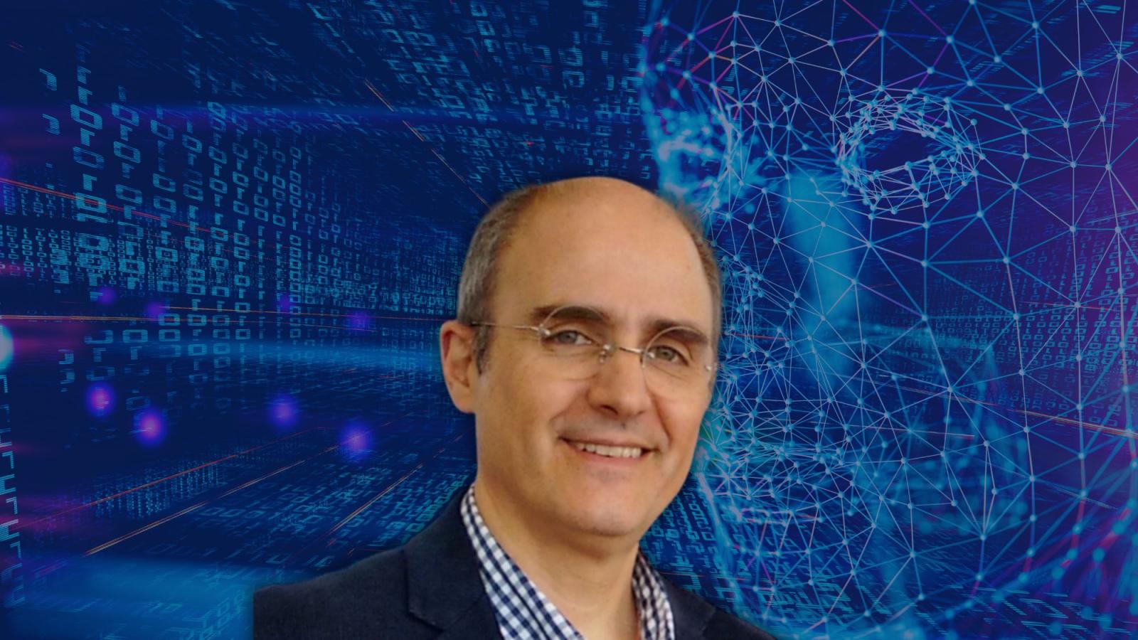 Headshot of Seidenberg professor Dr. Miguel Mosteiro, in front of a digital background.