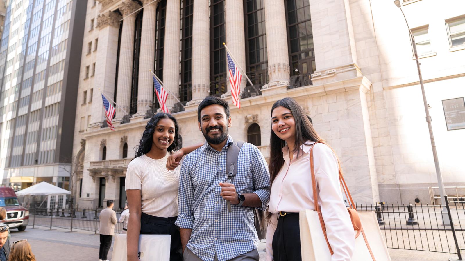 Pace students standing on Wall Street in New York City