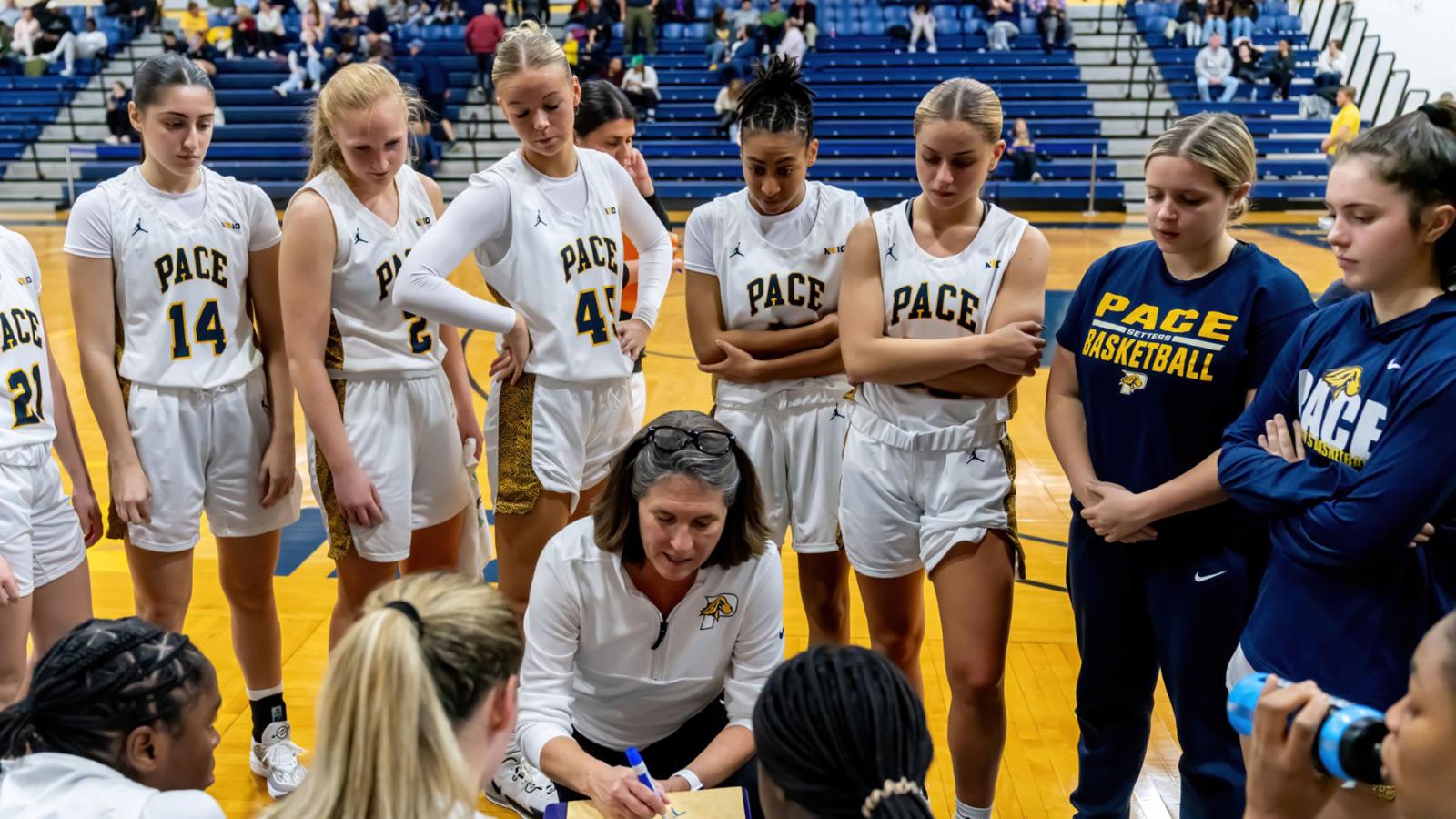 Pace women's basketball coach Carrie Seymour talking to team during timeout