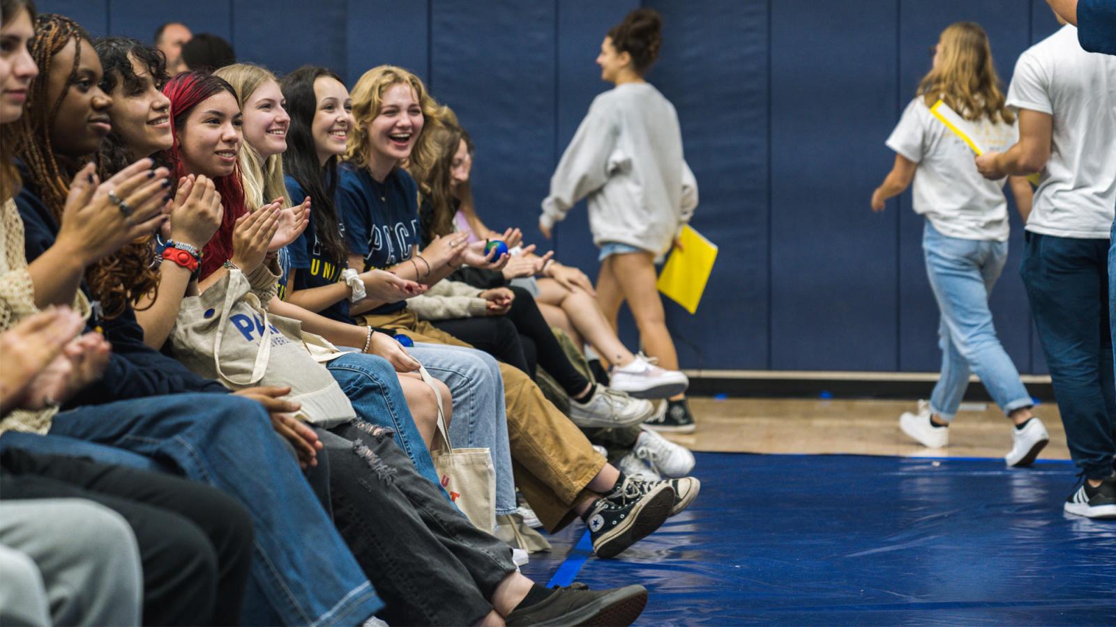 A group of Pace University students sitting in the crowd at Convocation.