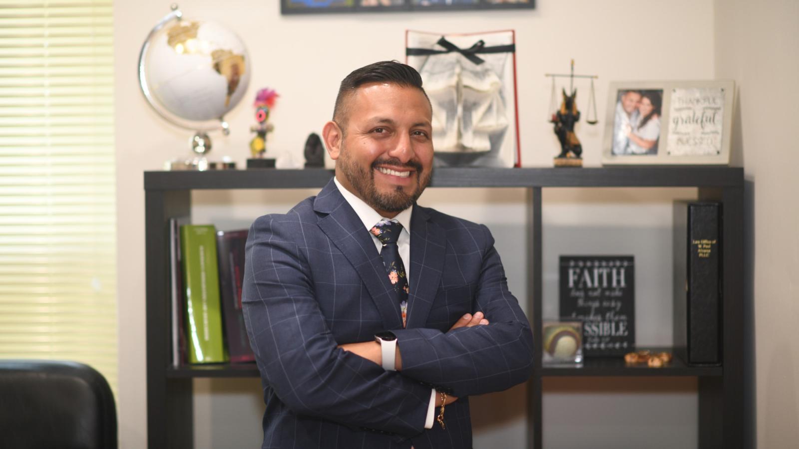 Elisabeth Haub School of Law Alumnus W. Paul Alvarez standing in his office