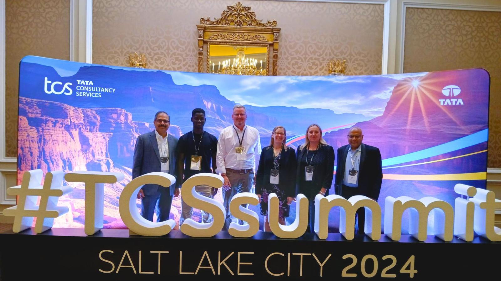 Pace University Seidenberg School of CSIS Professor Dr. Christelle Scharff (2nd from right) posing for a photo with industry partners at the TCS Summit in Salt Lake City.