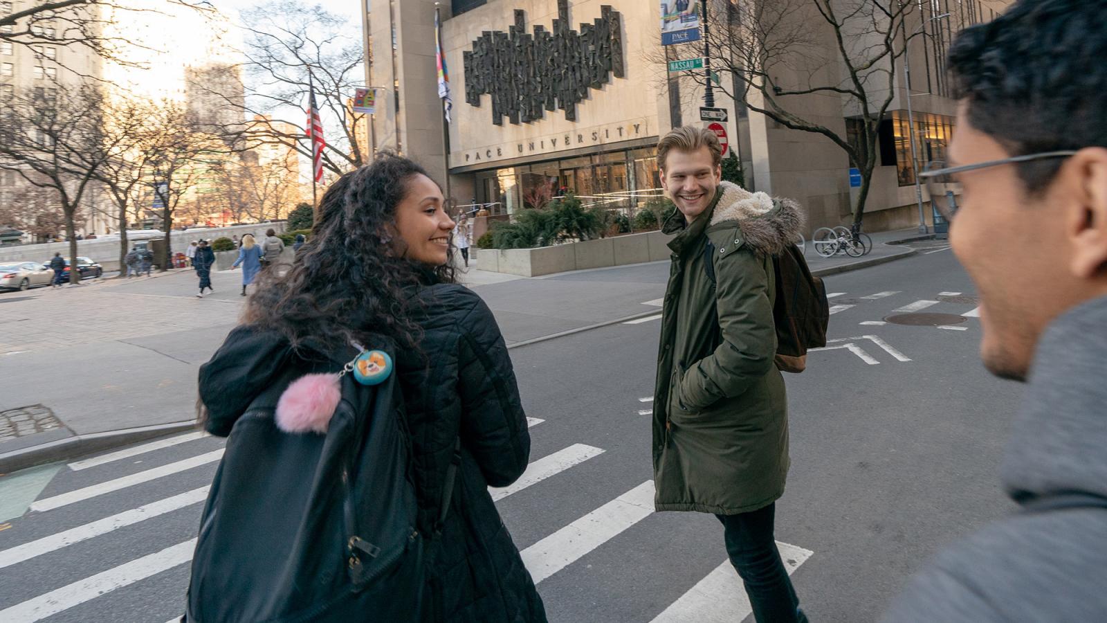 Pace University students walking into 1 Pace Plaza in NYC.