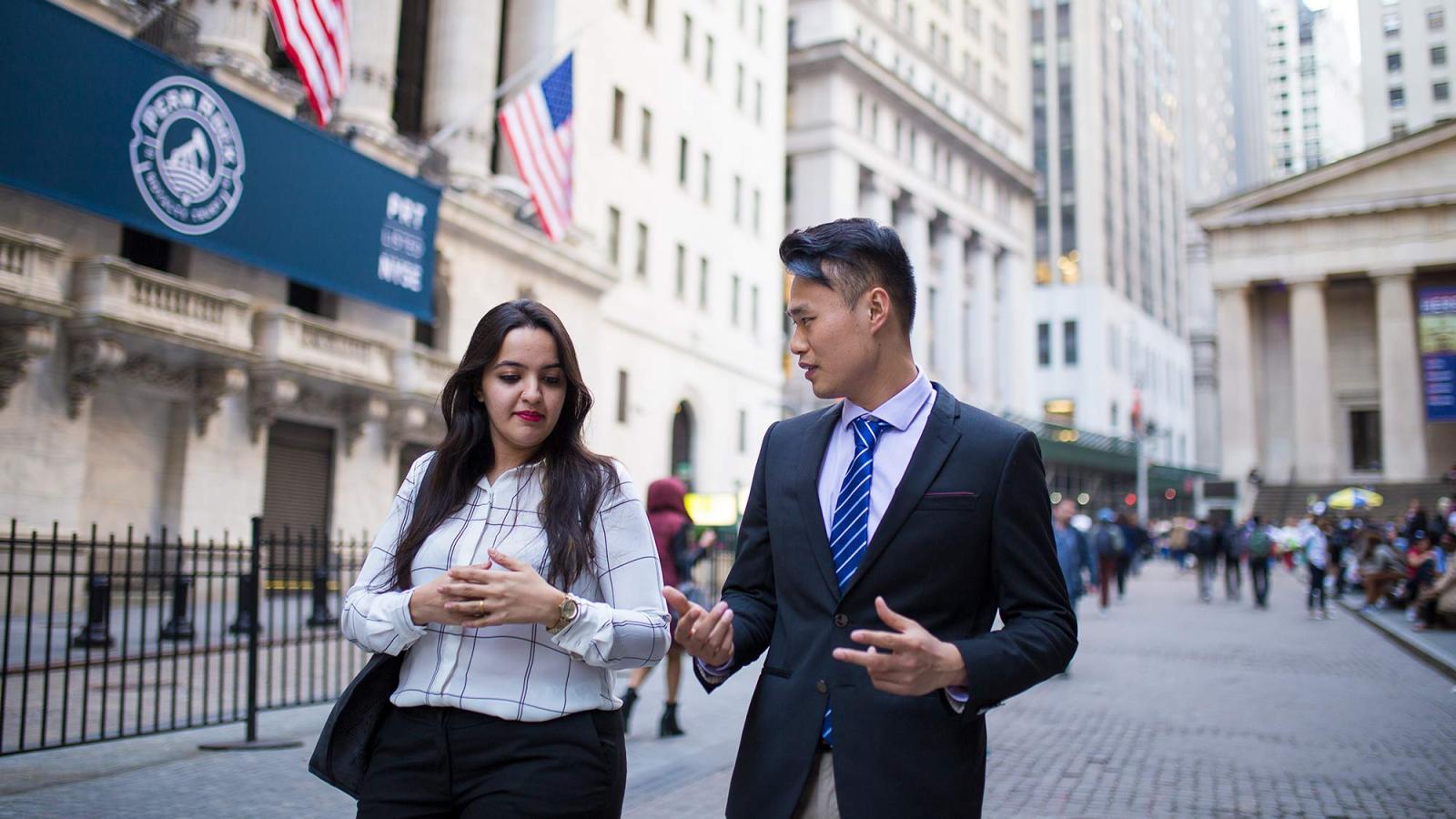 Pace University students dressed in business attire walking around NYC.