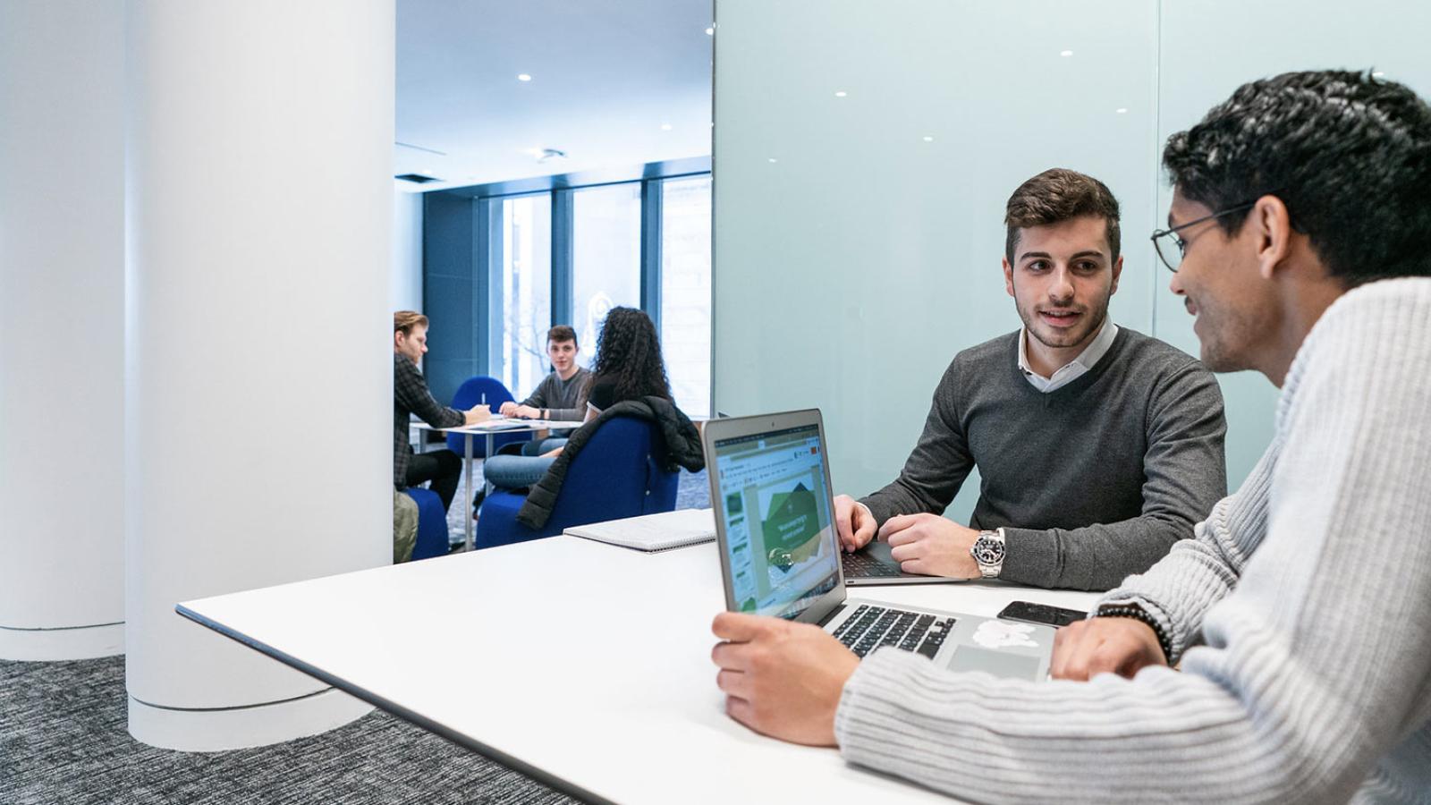 Pace University IT security team using a laptop