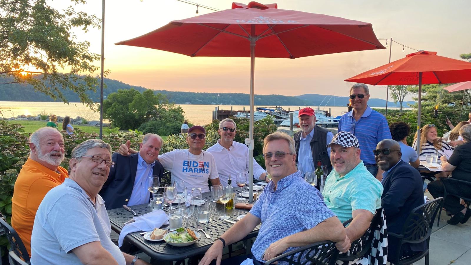 A group of Haub Law alumni, Dean Anderson, Professor Jay Carlisle, pictured outdoors in the summer