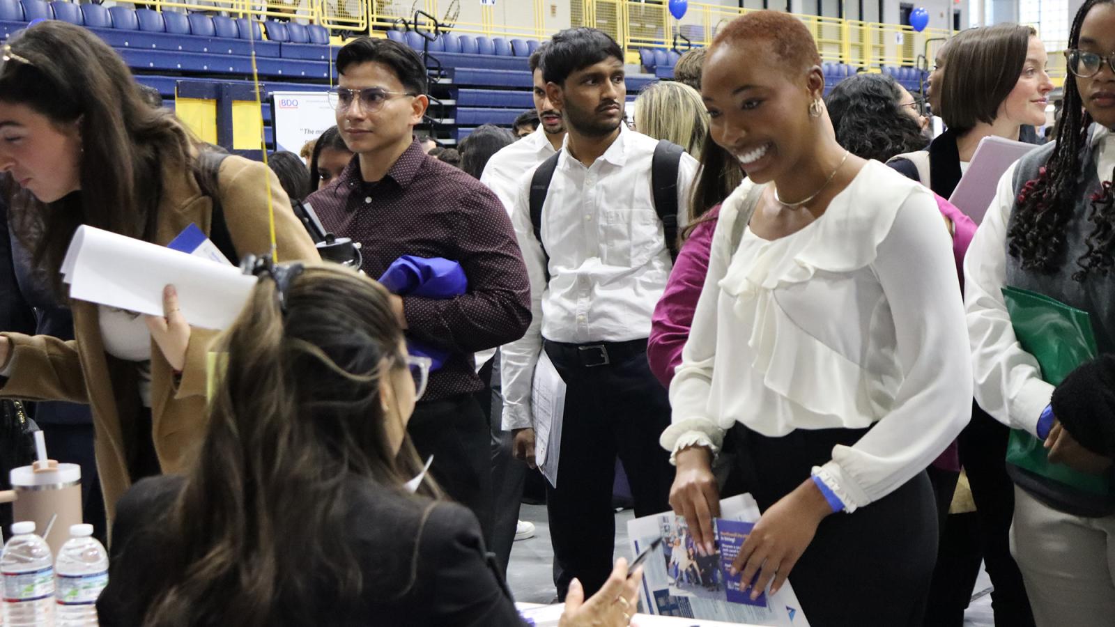 Pace University student connects with a Northwell Health representative at the Fall 2024 Job and Internship Fair.