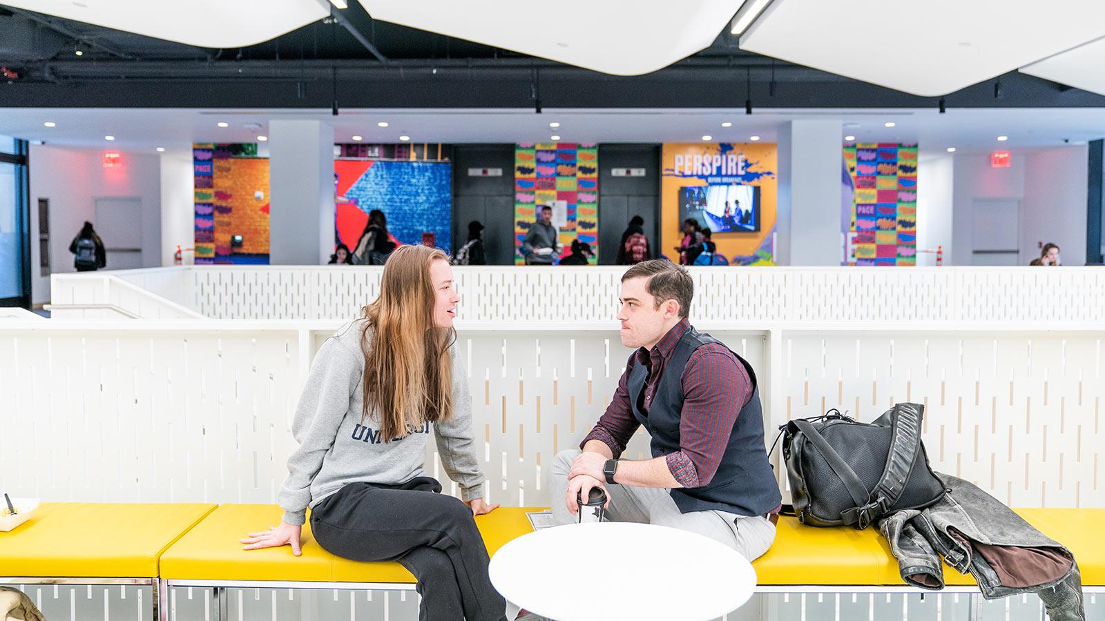 Two pace university students speaking at One Pace Plaza