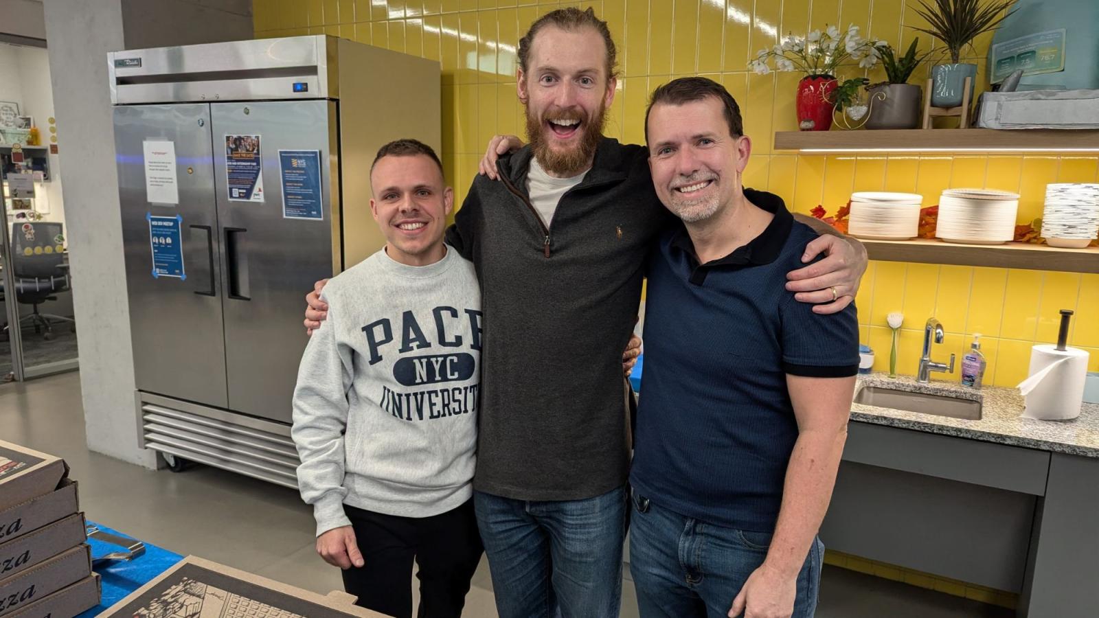 Pace Seidenberg student Fabian Hiller (L) posing for a photo with the Web Dev Meetup speakers in the Design Factory space of 15 Beekman.