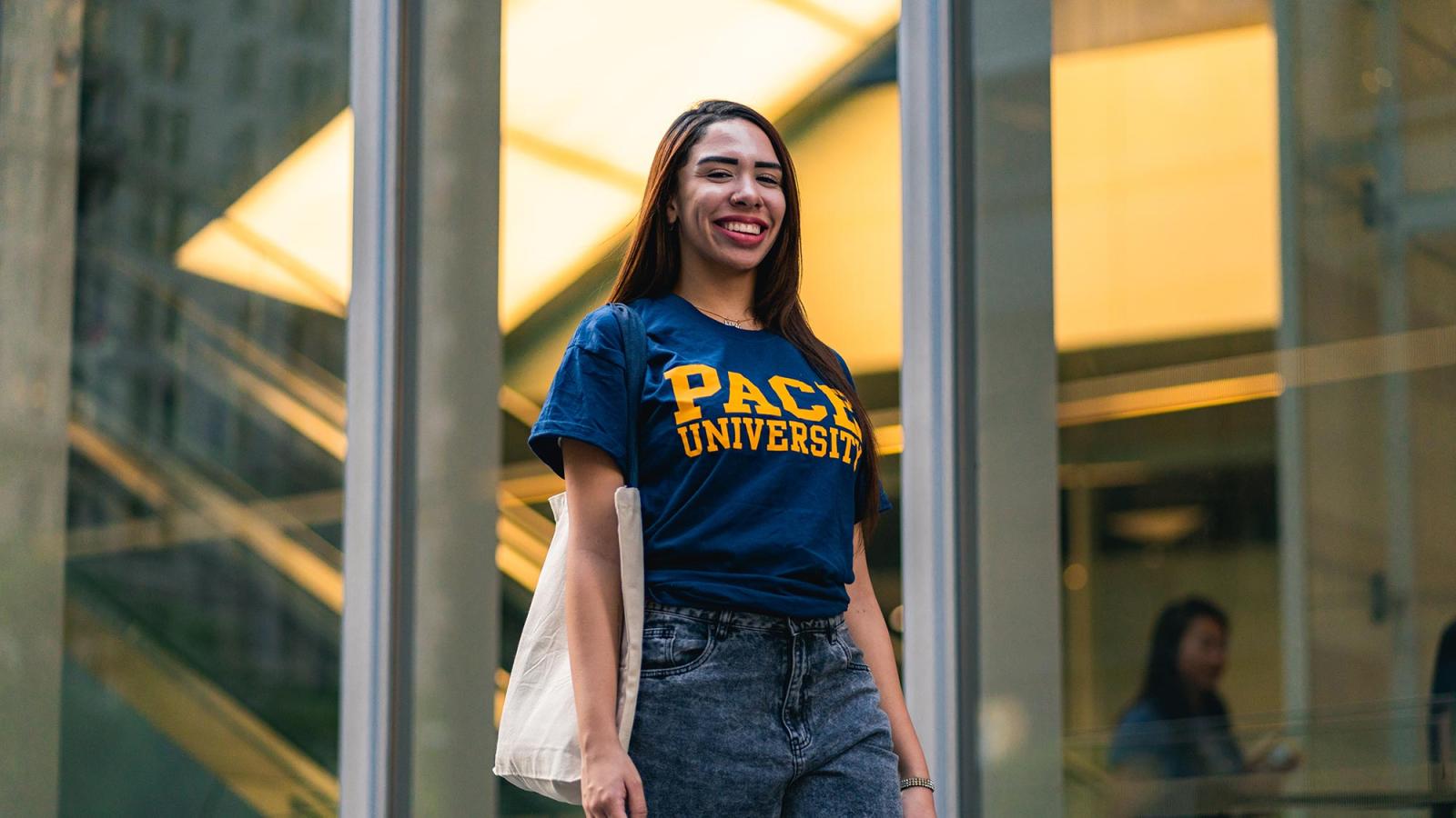 Pace University student walking on NYC Campus