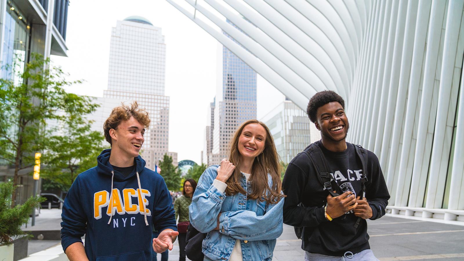 Three Pace students walking in Lower Manhattan