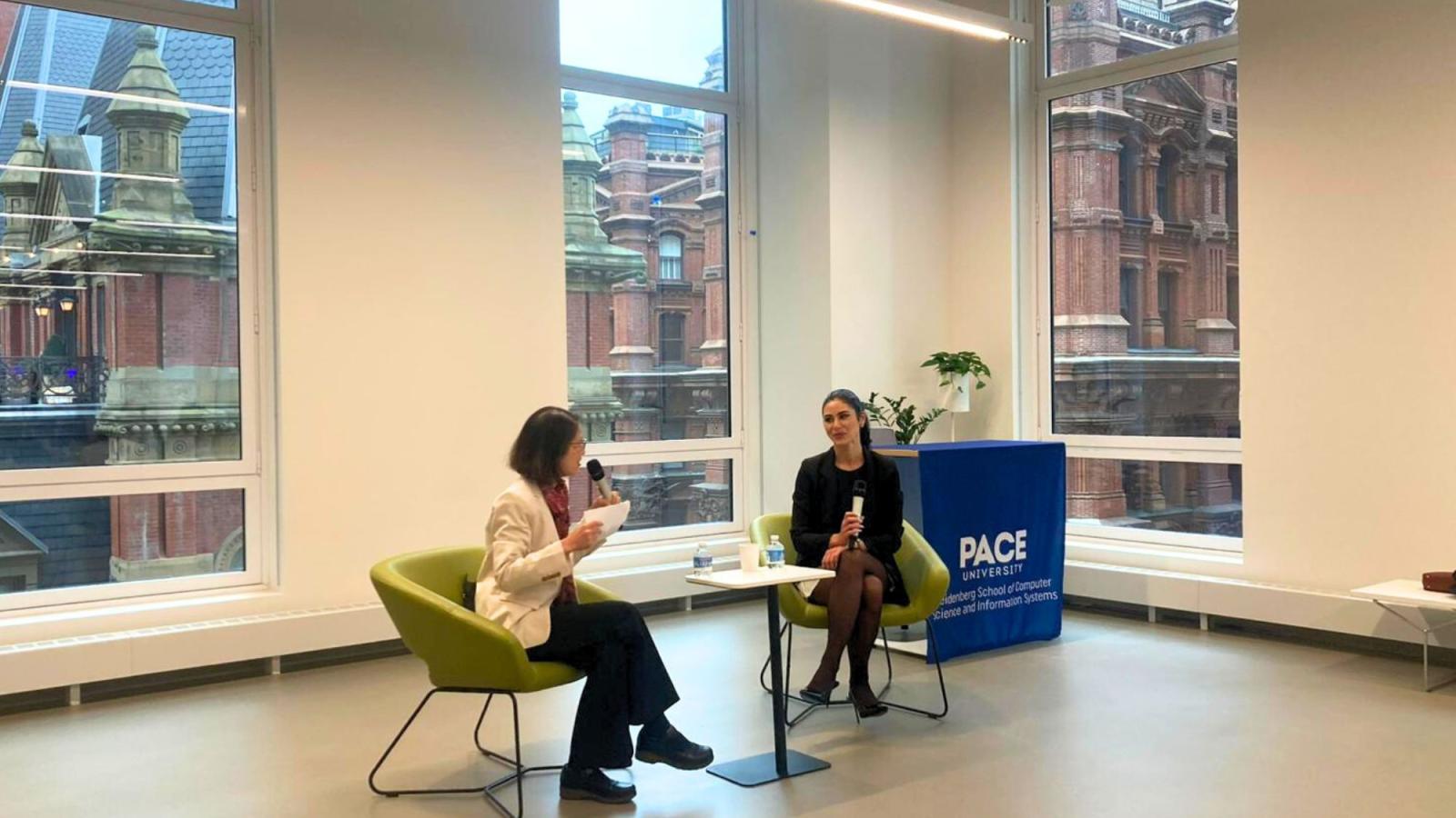 Pace University Seidenberg Interim Dean Li-Chiou Chen having a conversation with Emilie Nasseh at the Design Factory space.