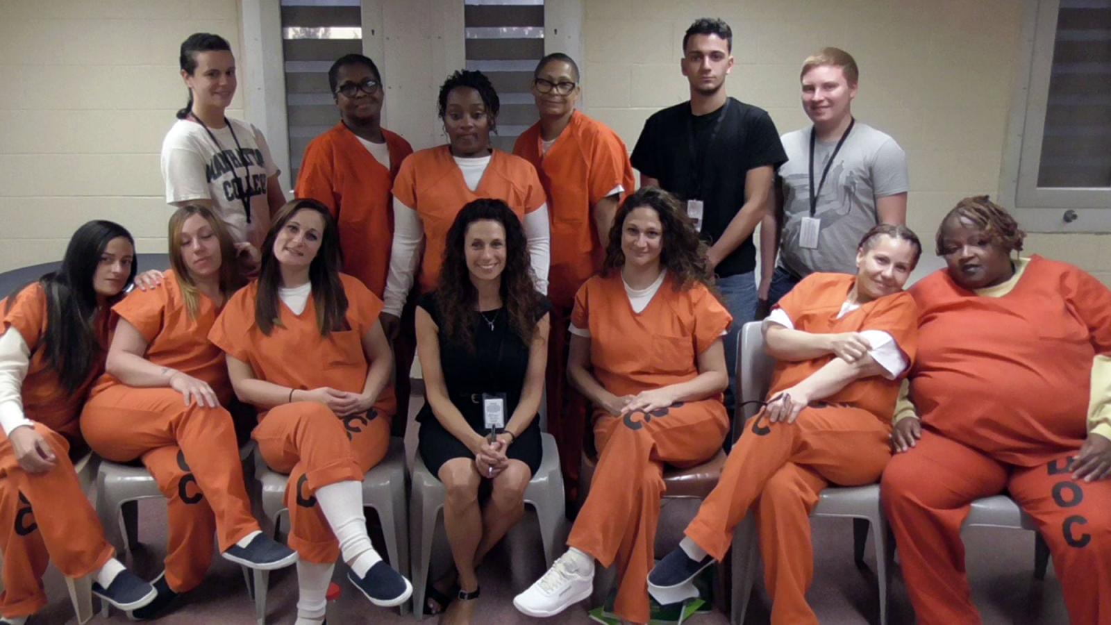 Pace University Criminal Justice and Security students with incarcerated women through the Parenting, Prison, and Pups program