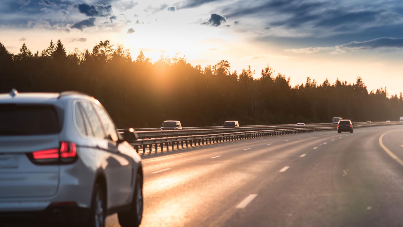 Cars driving down the high way. 