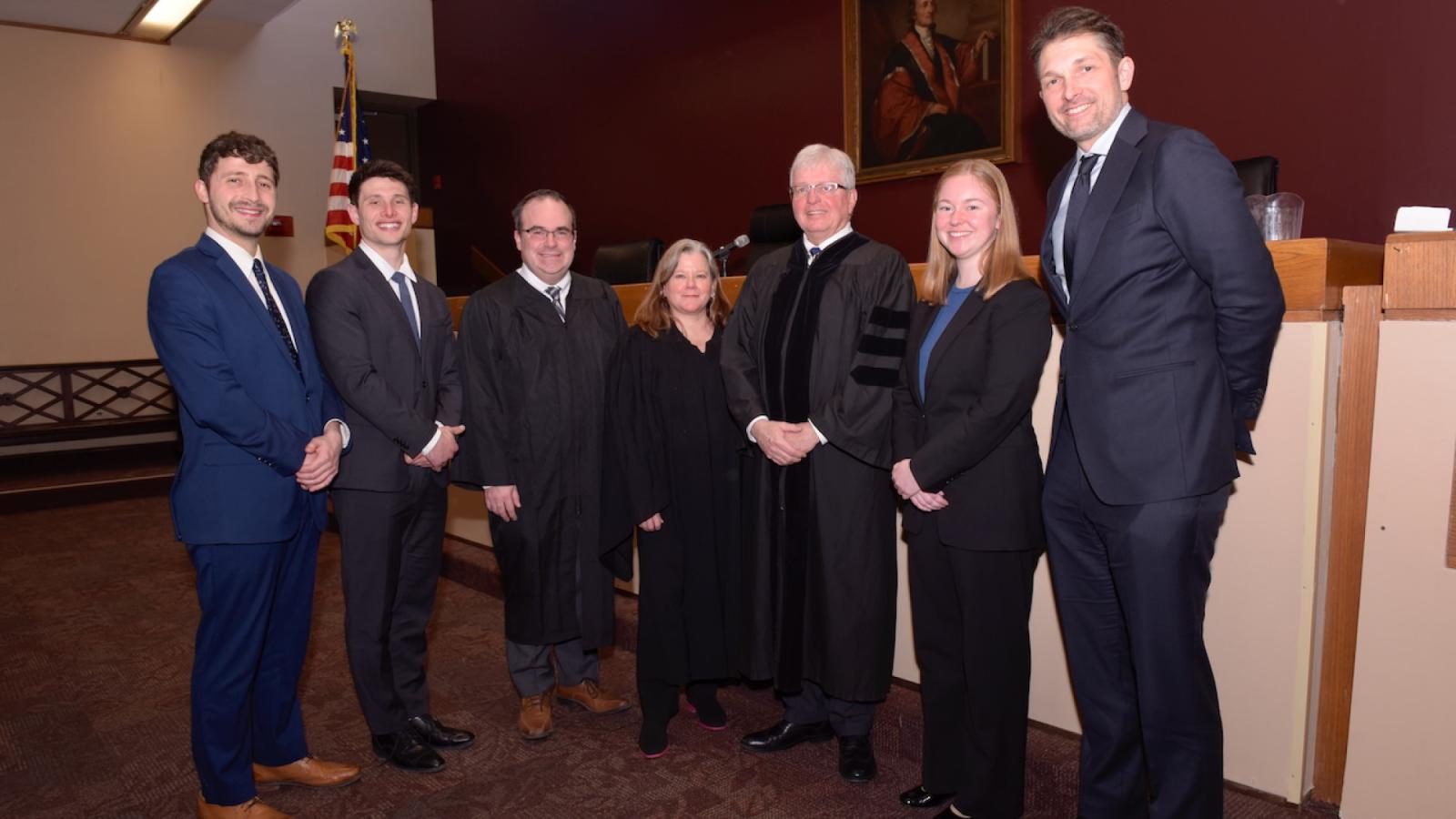 Elisabeth Haub School of Law at Pace University competitors, judges, and Professor Jason J. Czarnezki standing in the moot courtroom