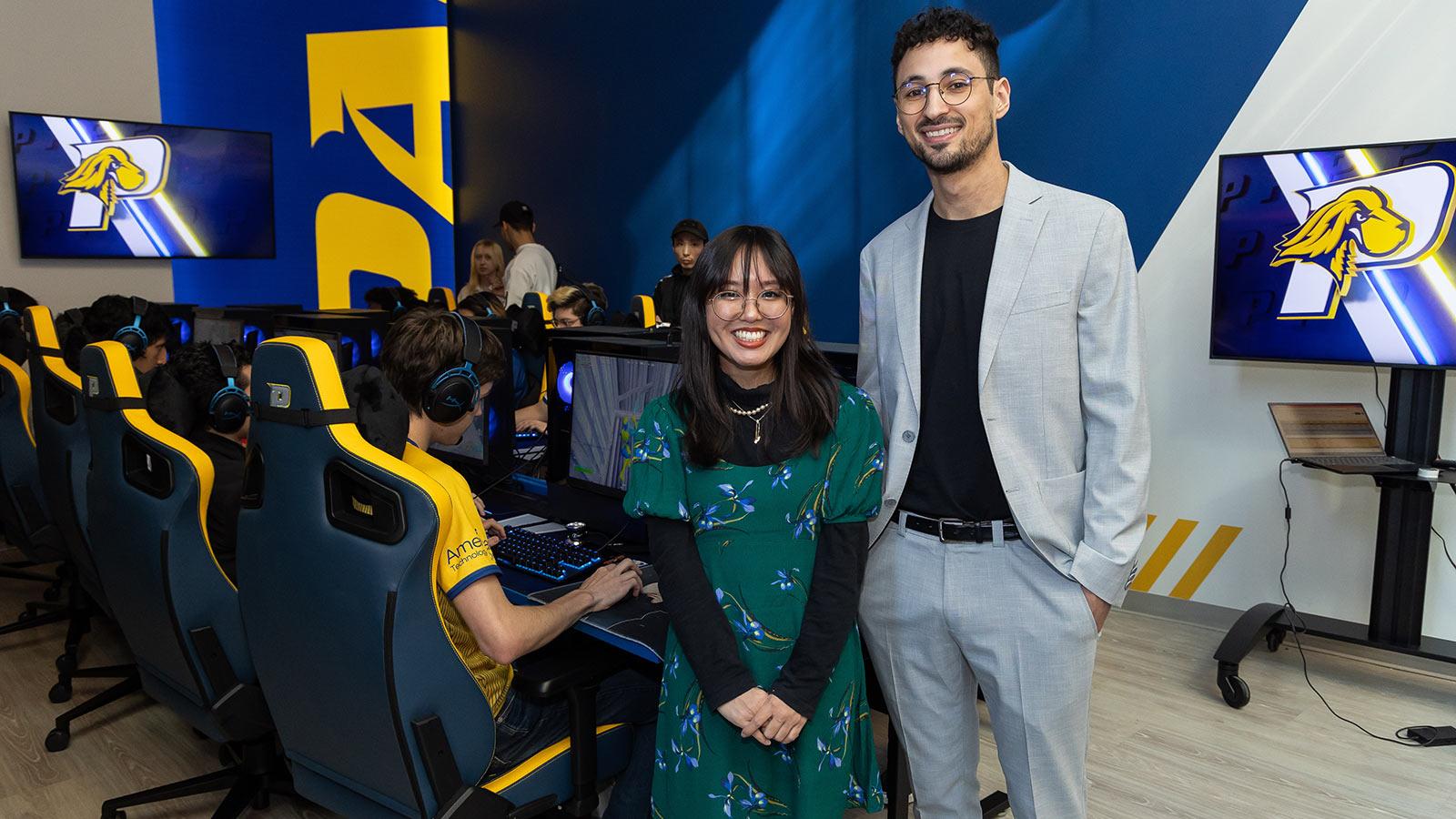 Director Jesse Bodony and assistant director Julia Cardillo stand in the NYC Esports arena