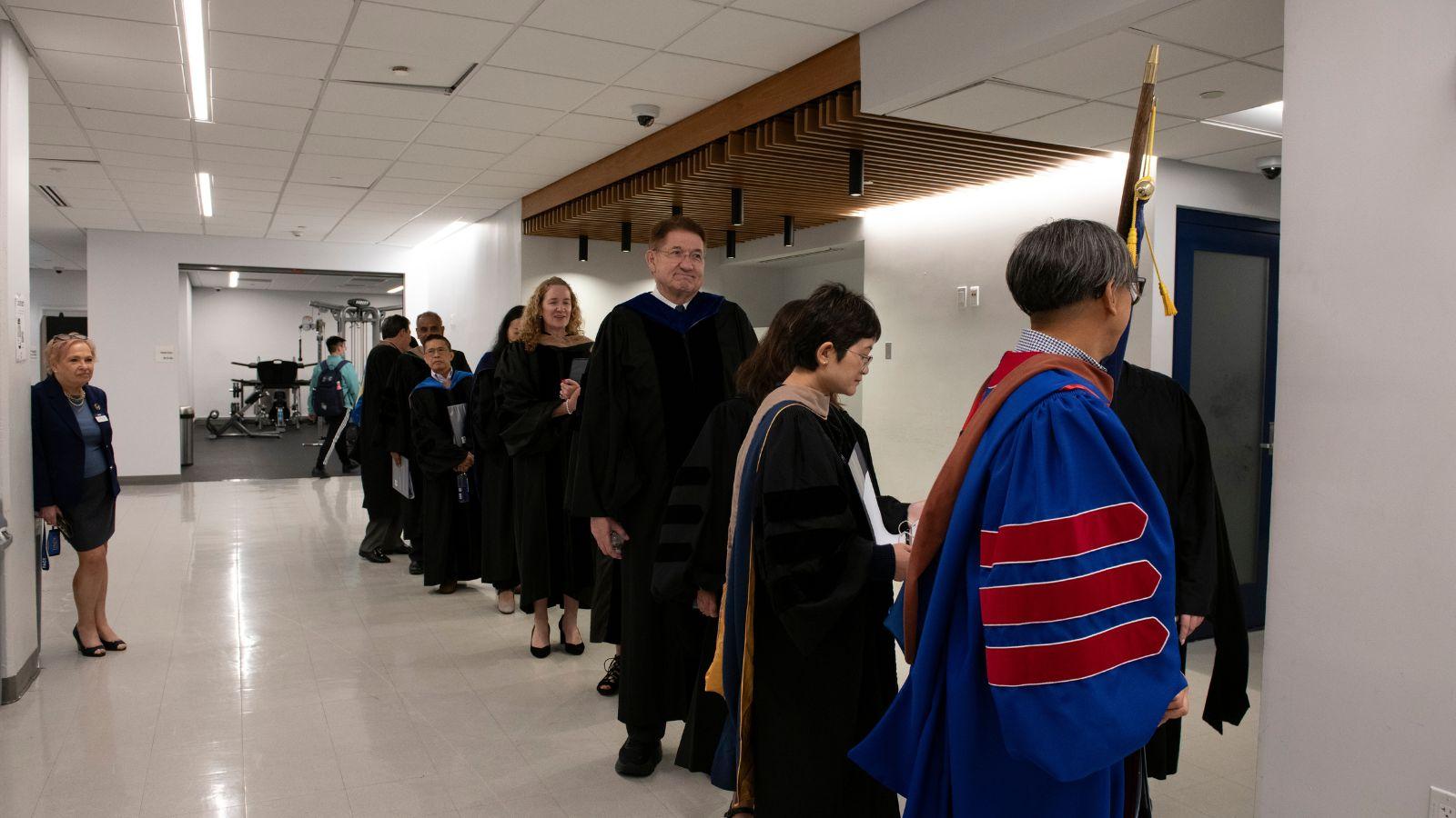 Dean Lawrence G. Singleton, faculty, and administrators prepare for the processional.