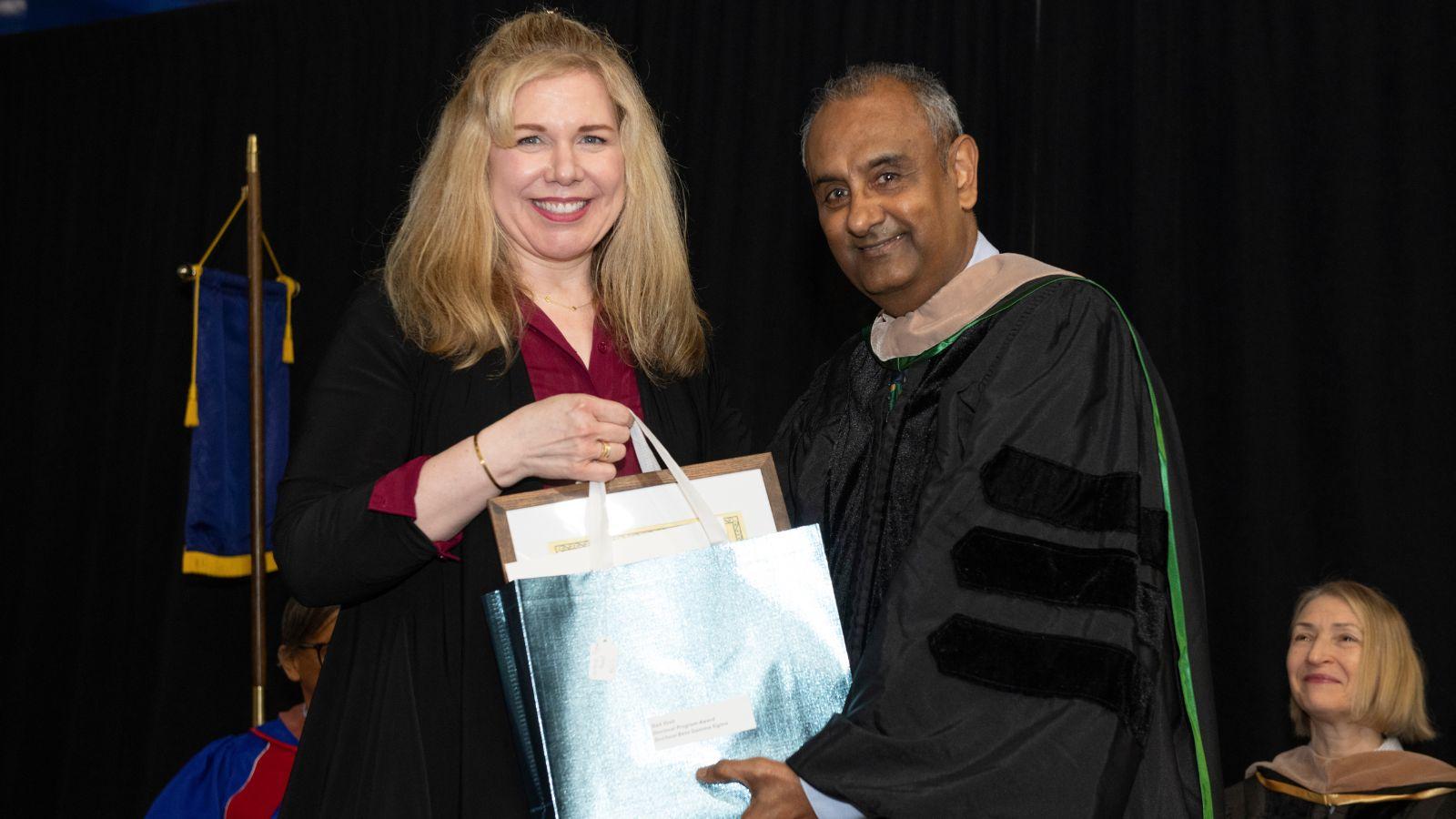 Dr. Pradeep Gopalakrishna with Gail Yosh, recipient of the Doctoral Program Award.
