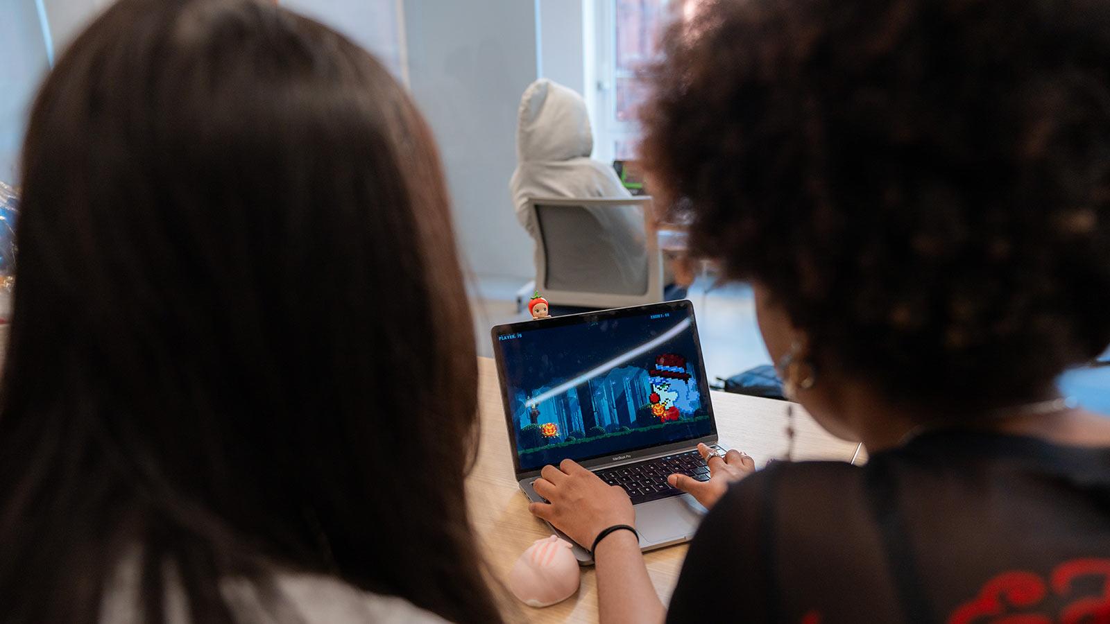 Pace students play a student game on a laptop