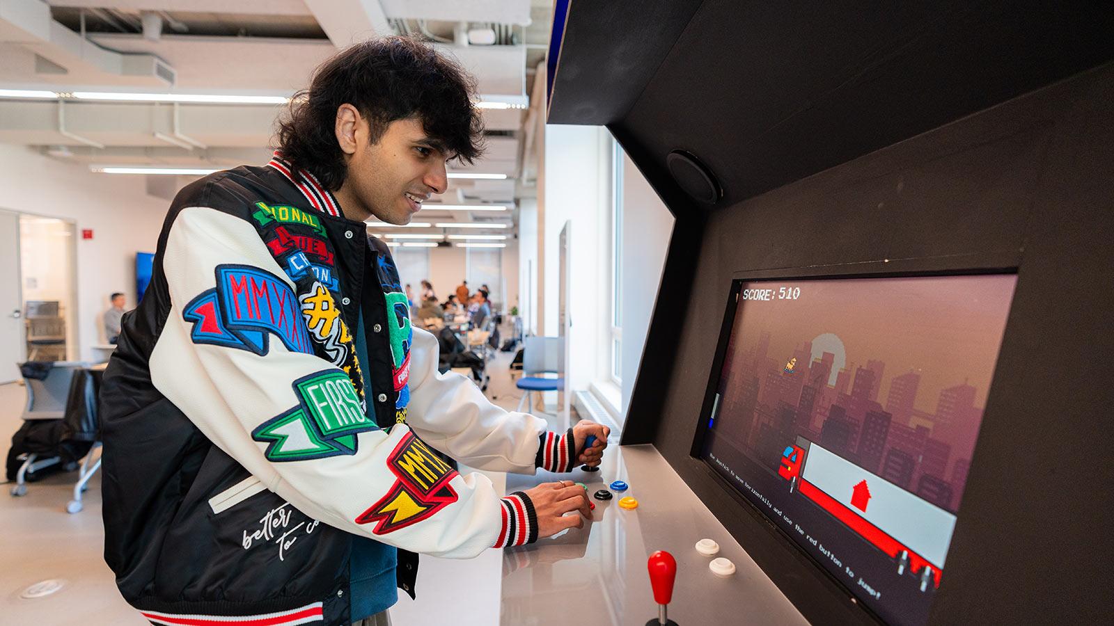 A Pace student plays at the 15 Beekman arcade machine 