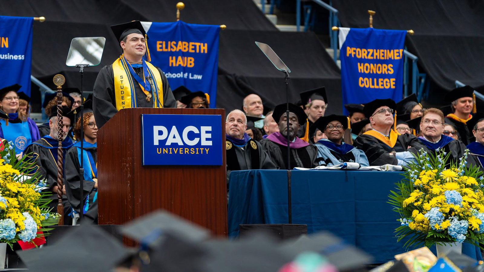 Pace grad posing at Commencement. 