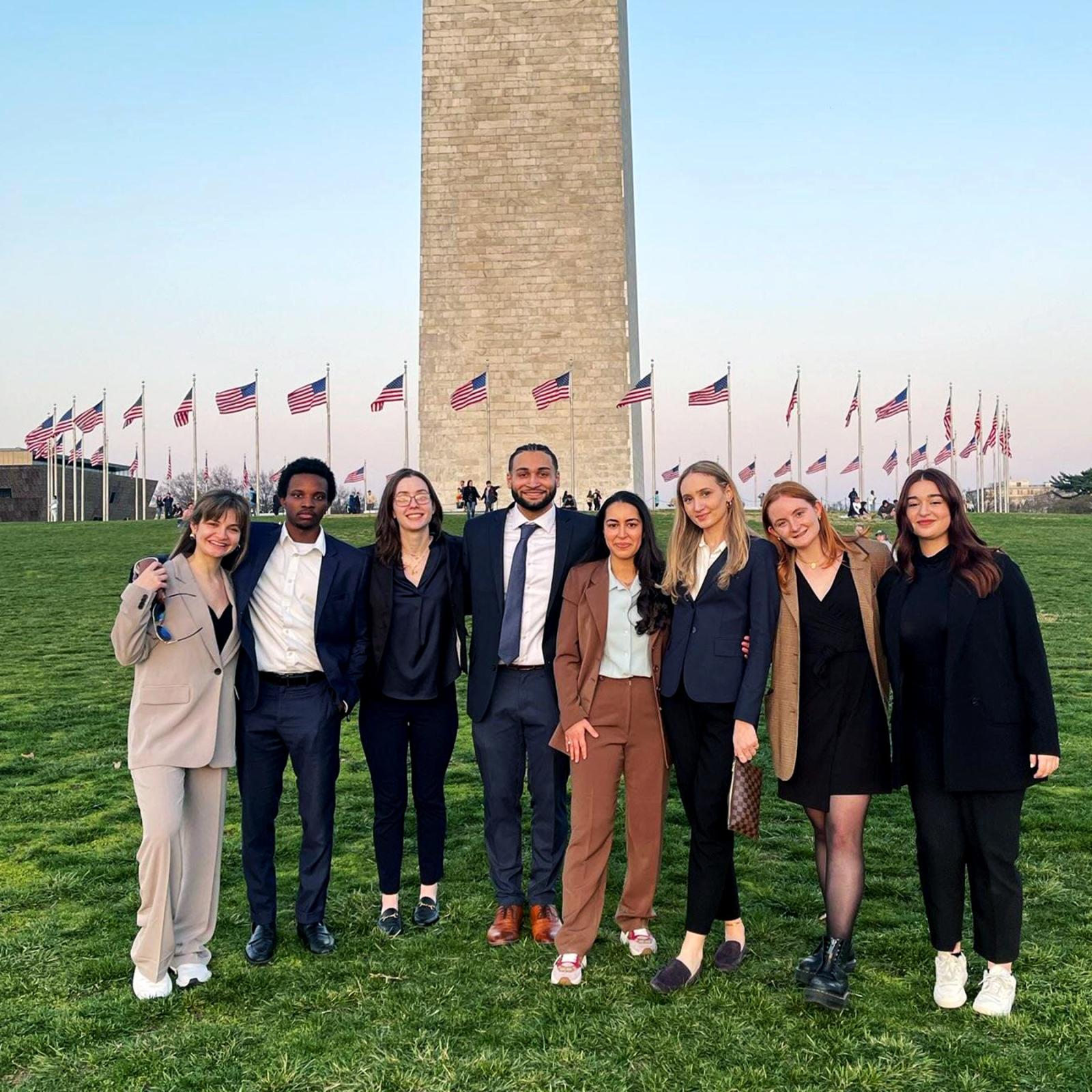 Group of Pace University economics students on the Fiscal Challenge Team standing in front of the Washington Monument