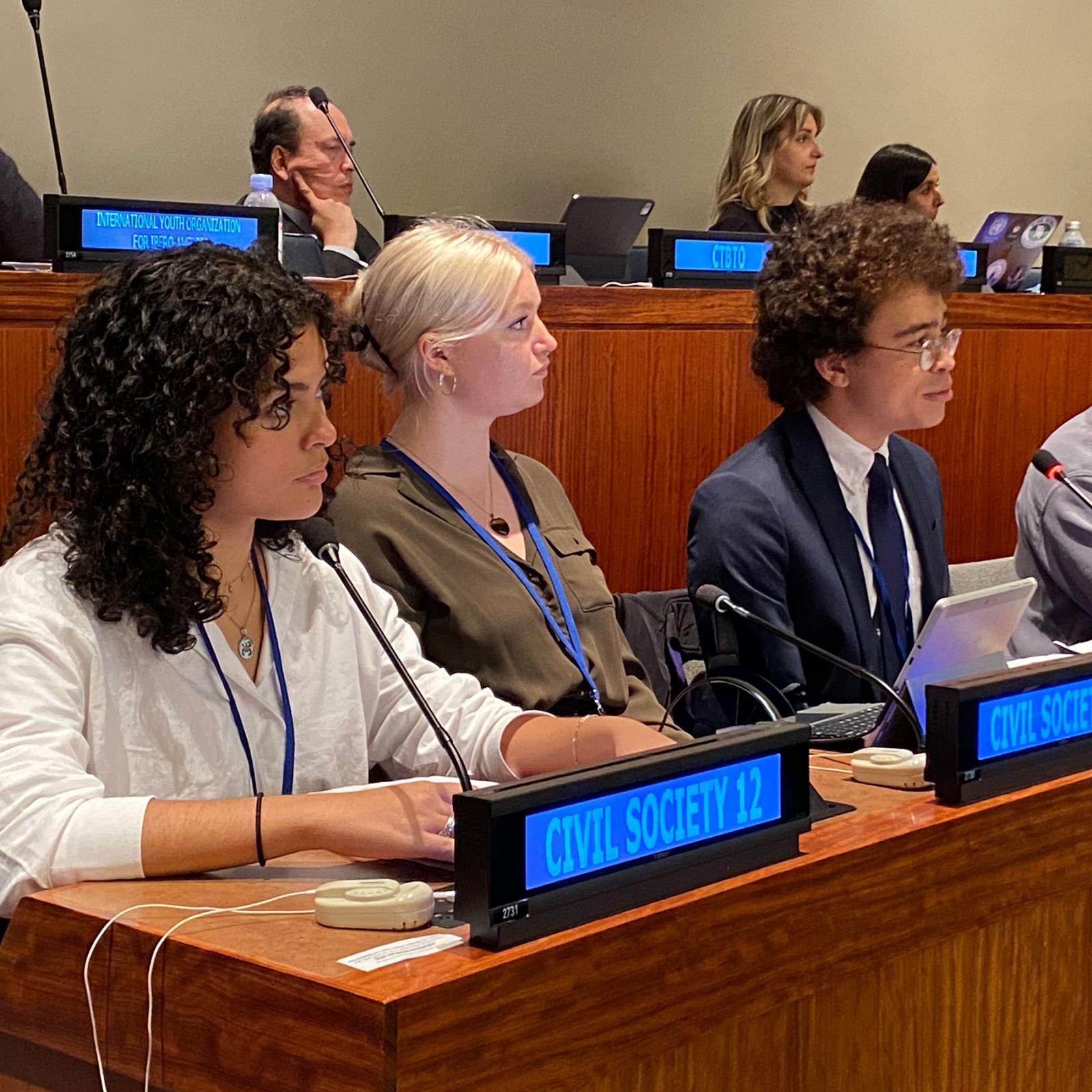 Pace University students Jasmine Cintron ‘25, Antje Hipkins ‘24, and Ellis Clay ’25 speaking at the United Nations General Assembly First Committee.