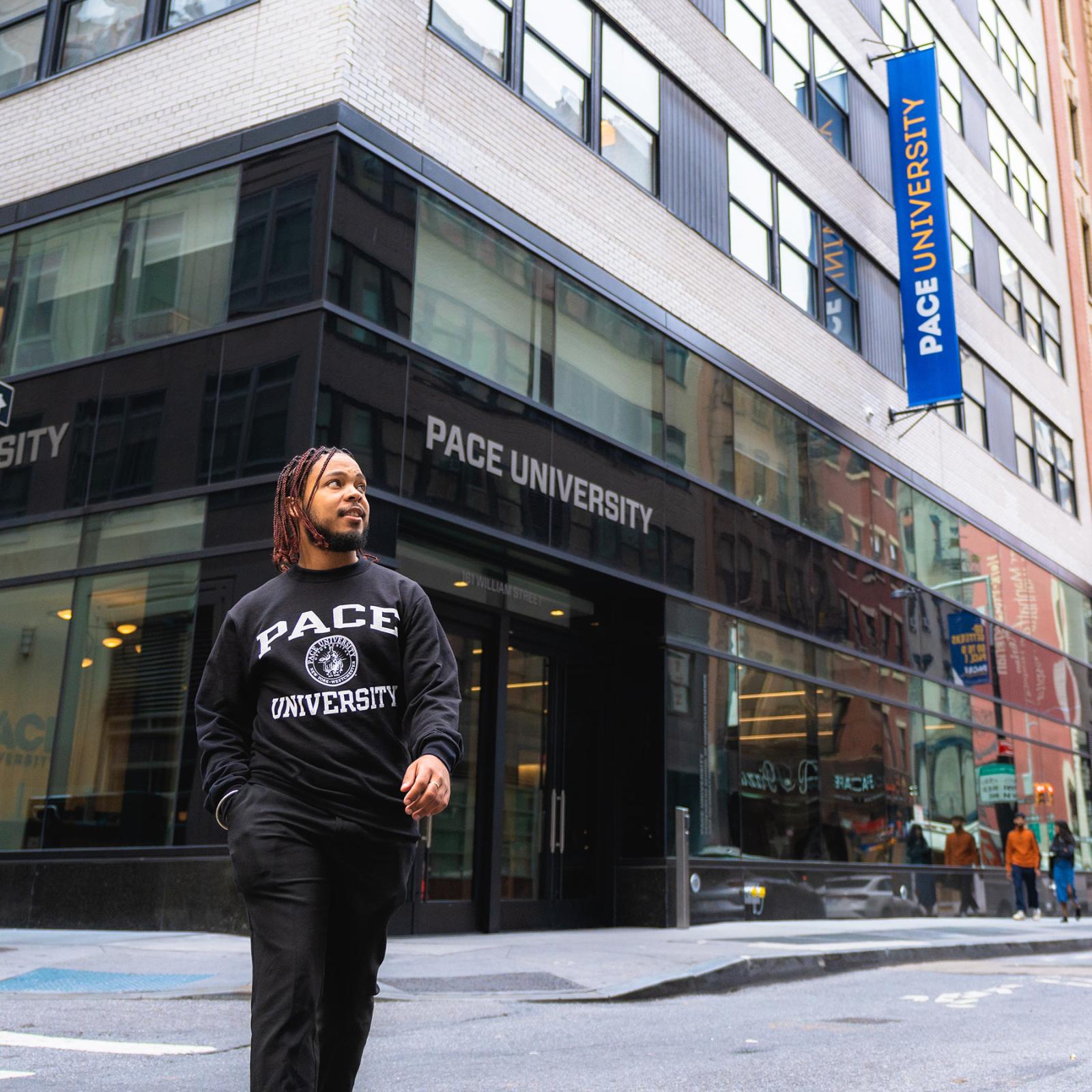 Pace University student crossing the street in lower Manhattan