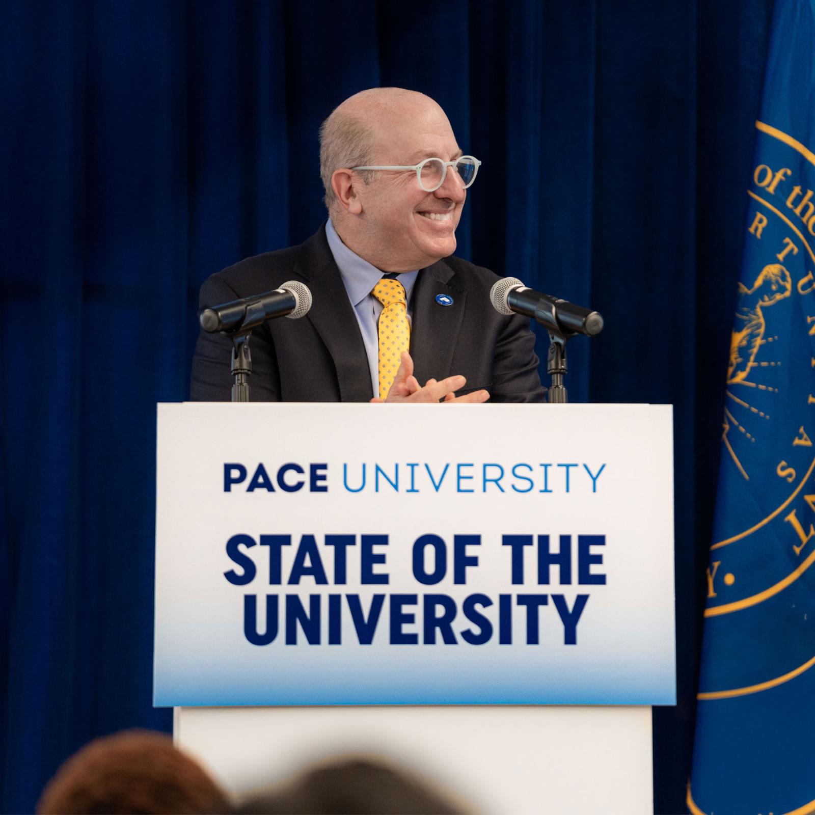 President Krislov at the podium for the 2025 State of the University Address. 